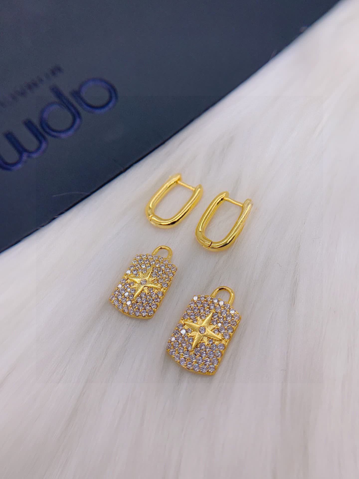 APM Monaco Elegant Gold and Diamond Star Earrings